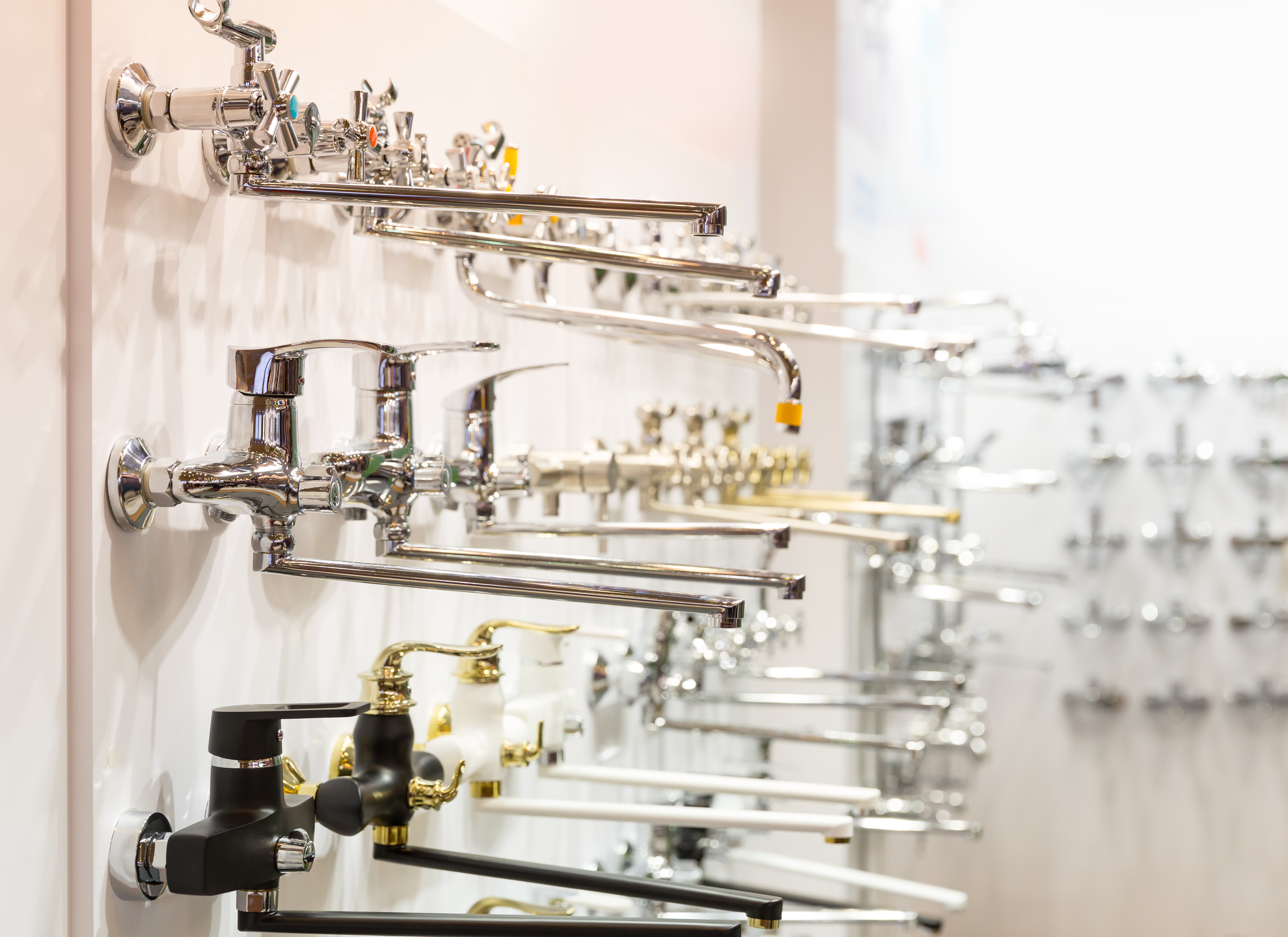 Rows of new faucets for bathroom in plumbing shop